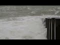 a windy day on eastbourne beach with rough seas