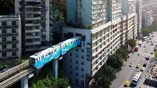 Chinese train that goes THROUGH a block of flats: Chongqing Mountain City