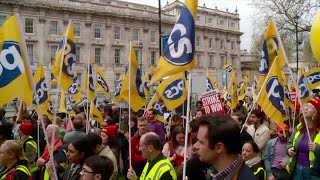 130,000 UK civil servants strike over pay and working conditions