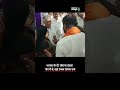 watch karnataka minister slaps woman yet woman touches his feet for blessings