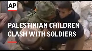 Palestinian children clash with soldiers at checkpoint