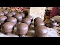 village workers making clay pots from scratch traditional craftsmanship