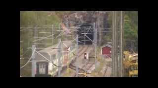 Finnish InterCity2 trains 953 and 958 passes Pohjankuru station and railway tunnel