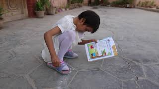 Kashgar old city. Xinjiang, Uyghur girl learns English.