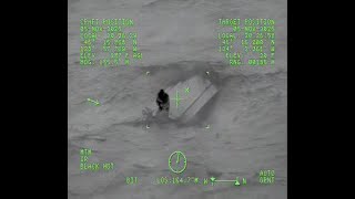 Coast Guard Rescues Father and Son clinging to life on Overturned Vessel