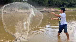 Throw a net into the Amazon River to catch tropical fish