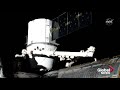 spacex dragon cargo craft arrives at iss with help of canadian made robotic arm