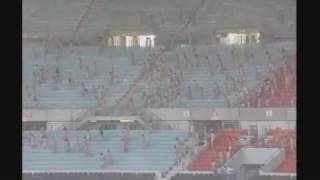 HUNDREDS STRIP AT FOOTBALL STADIUM