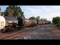 canadian national eastbound 396 3207 bnsf 7004 in durand michigan june 6 2021.