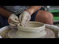 throwing a shallow bowl on the pottery wheel