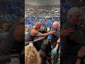 The Rock greets some Make-a-Wish families after laying the SmackDown on Austin Theory