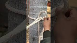 The process of securing a rope around a tree