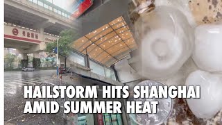 HAIL, GALE, THUNDERSTORM AND TORRENTIAL RAIN descend upon Shanghai on a hot summer day