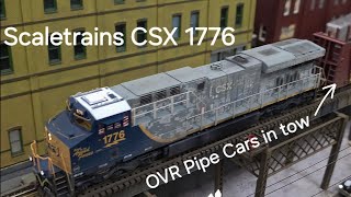 Scaletrains CSX 1776 pulls Otter Valley Pipe Cars