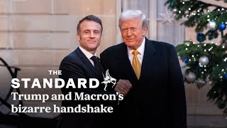 Trump and Macron share white knuckle handshake at Elysee Palace