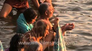 Hindu devotees taking a holy dip during Maha Shivratri at Varanasi Ghat