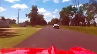 SS Torana flying past 57 Chev