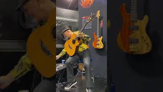 Frank Gambale demonstrates the new Cort acoustic guitar at winter NAMM 2020.