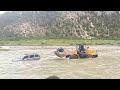 Bulldozer rescues four stranded passengers from rapids in China