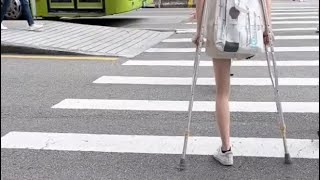 Gorgeous One Legged Asian Amputee Woman Crossing The Busy Street With Crutches-Amputee Girl Walking