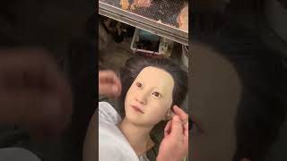 Install a big eye silicone figure on the wax figure child. Wax figure making. Purely handmade. Craf