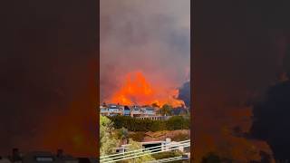 Los Angeles wildfires: 2 dead and crews struggle to contain blazes as thousands flee