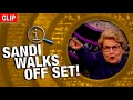 QI | Sandi Walks Off Set!