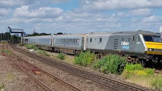 82304 DVT leads 68010 through Tyseley on 9th August 2024.