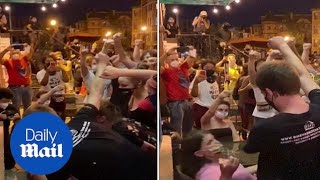 BLM protesters confronts woman who won't raise her fist in solidarity