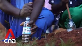 Ugandan women make eco-bricks from plastic waste to build water tanks