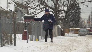 Postal carriers, couriers battling snow-covered streets and sidewalks