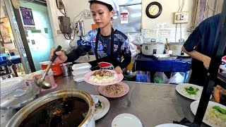 Eating Duck with rice at the restaurant in Vientiane, Laos.