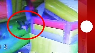 Dramatic: Bouncy castle blown over by wind with children inside (China)