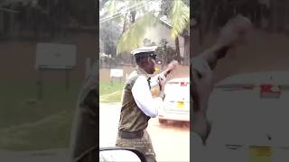 Traffic officer, Abdallah Tusiime, who braved the heavy rain to control traffic #shorts #shortsvideo