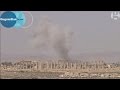 Isis in Palmyra; smoke rises over Syrian ancient ruins