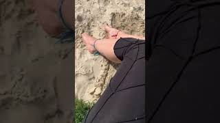 Flip flops bare feet sand play