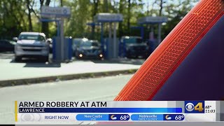 Lawrence Police hunt for two men in armed robbery of a Brinks employee at an ATM