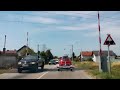 popovaca raising the railway crossing gate at the rail crossing with signals