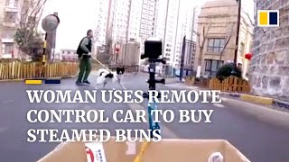 Woman uses remote control car to buy steamed buns amid coronavirus outbreak in China