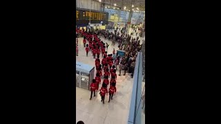 Foot Guards Stream Through Waterloo Station for Coronation Rehearsals