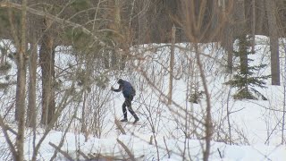 Families play in the snow at Hartley Nature Center