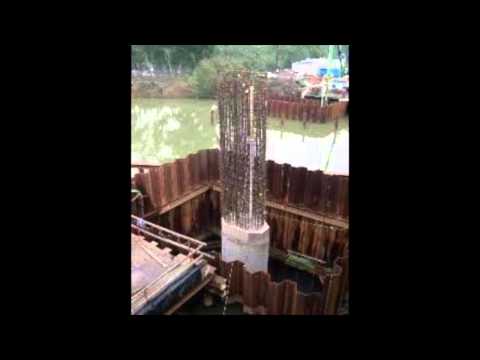 How do engineers build bridge towers under water? How do engineers build bridge towers under water?
