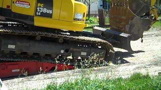 Unloading the Komatsu PC 138 US LC excavator