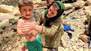 Mrs. Rababah, a nomadic woman and her children in the mountains