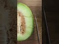 Cutting open a Haogen Melon.