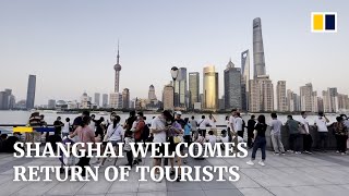 Chinese tourists return to Shanghai for first ‘golden week’ holiday since Covid rules eased