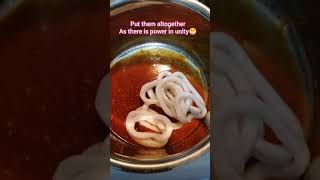 Korean Food cooking (mushrooms, fish cake, rice cake, squid rings in Gochujang sauce)