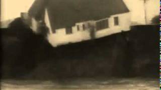 Beach erosion destroying a home