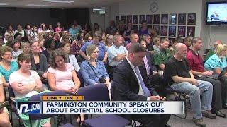Community learns about possible school closings.