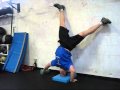 Assisted One Arm Handstand Pushup